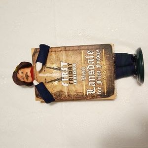 Buyer's Choice Limited, 2010 man caroler with signboard for First Friday